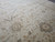 19'4" x 19'5" square Oriental rug viewed at an angle showing dark brown rosette detail