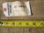 Back tag reading PIX-15474, 19 ft 5 in by 19 ft 4 in, beside tape measure