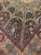 Black arched niches filled with floral vinework above camel and burgundy panelled outer border