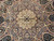 Overhead detail of radiating star wedges in slate blue, ivory and camel wool with silk