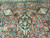 Navy pendant cartouche and gold palmettes rising above a coral field of leaves and blossoms
