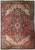 Semi-antique Persian Heriz rug with rustic red field, ivory corner spandrels and navy geometric medallion