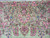 Border detail showing rose vase motif, blue buds and a small woven cartouche above