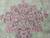 Central floral medallion in rose and blue floating on the celadon green Kerman field