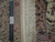 8x10 Sino Tabriz rug back showing tight knot count beside ruler and hand knotted tag