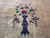 Center vase motif in navy and teal holding burgundy and purple flowering branches