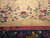 Field detail showing open beige ground, blossom sprays and the burgundy inner border stripe
