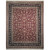 Burgundy all over floral field framed by a black border on this hand-knotted wool rug