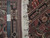 Ruler across the weave showing roughly 200 knots per square inch and hand knotted tag