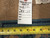 Reverse of the 9x11 Chinese rug with hand-knotted weave, inventory tag and tape measure