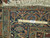 Ruler across the 9'8" x 13' Heriz border showing hand-knotted wool pile density