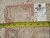 Back of the rug with tag 5984 and tape measure showing hand-knotted wool weave