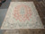 Room sized 10' x 12'10" Kerman rug photographed flat under natural warehouse lighting