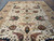 Wide angle of the 11'8" x 18'7" Oushak rug showing symmetrical all-over floral layout and borders