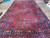 11 x 20.6 Persian Sarouk rug shown full length on the polished showroom floor