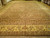 16' x 28'3" Indian Jaipur rug displayed flat in showroom with beige palmette border