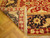 Corner folded back revealing tight hand-knotted wool weave, cotton foundation and hand-tied ivory fringe