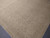 Close corner detail showing arch and palmette border motifs in soft taupe, ivory and sage tones