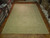 13'6" x 19'2" Chobi rug laid flat on parquet floor inside the Freeport rug showroom