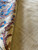 Reverse of rug showing fine cotton foundation and even knotting under dense wool pile
