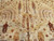 Close-up of weeping willow and cypress motifs woven in rust, brown and pale blue wool