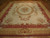 9 x 12 Aubusson rug with ivory floral field, rose medallion and rustic red border
