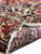 Reverse side weave and knot density visible along the folded fringe of the 11x13 rug