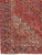 Corner detail showing ivory spandrel, navy main border and camel guard stripes on hand-knotted wool