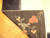 Back of the hand-knotted wool rug showing tight weave, cotton foundation and clear floral drawing