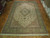 Palace size 12'10" x 19'5" Tabriz rug displayed on parquet floor in Freeport showroom