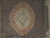 Close-up of ivory central medallion with sage green, rose and gold silk highlight detail