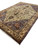 Three quarter view of 11'3" x 16' oversize Persian rug with fringe in foreground