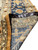 Reverse folded back to show cotton foundation, clear knot definition and leather bound rug edge