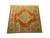 12x12 square Oriental rug shown at an angle with stepped corner motifs in soft blue green
