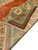 Back and side finish of the hand-knotted wool rug folded to show weave density