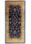 8'9" x 19'6" Persian Kerman rug shown flat, navy field framed by camel gold border