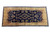 Full overhead view of oversize navy gallery rug with all-over floral sprays and ivory outer border
