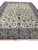 Angled floor view showing 12'3" x 17'2" Kashan rug ivory field and green border