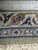 Back of the 8'10" x 18'1" Persian Kashan measured with a ruler showing fine knot grid