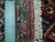 Ruler against cotton fringe and back weave documenting knot density of this 9'6" x 16'2" Persian rug