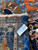 Inventory tag reading 14389 on the reverse of this genuine hand-woven oversize Persian Heriz rug