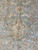 Center of the field showing ivory palmette motif with brick red accent outlines