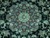 Close-up of the burgundy central medallion surrounded by ivory palmettes and rose blossoms on black wool