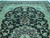 Black field with curling acanthus scrolls, celadon spandrels and silk-highlighted flowers across this hand-knotted Oriental rug