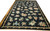 10'8 x 16'9 Chinese needlepoint rug laid on parquet floor showing full allover floral design