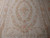 Detail of floral medallion with pink bow, rose wreath and pale sage leaf sprays