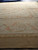 Close view of ivory border with coral ribbon, acanthus scroll and wide wheat outer band