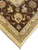 Corner detail of chocolate brown border with gold rosettes, palmettes and hand-finished selvage and fringe
