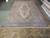 Large Persian Kerman rug with inventory tag 5591, ivory field and blue floral border
