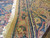 Edge and fringe detail showing hand-knotted wool pile and tight selvage of the rug